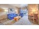 Cozy living room with comfortable seating, balcony access, and city views at 211 E Flamingo Rd # 402, Las Vegas, NV 89169