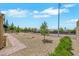 Spacious backyard with low-maintenance landscaping and brick paver pathway is perfect for outdoor enjoyment at 2166 Alyssa Jade Dr, Henderson, NV 89052