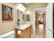Well-lit bathroom boasts a stylish vanity and convenient access to the living areas of the home at 2166 Alyssa Jade Dr, Henderson, NV 89052