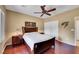 Comfortable bedroom offers hardwood floors, a ceiling fan, and a spacious closet for ample storage at 2166 Alyssa Jade Dr, Henderson, NV 89052