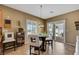 Bright breakfast nook boasts a glass table and views of the outside patio at 2166 Alyssa Jade Dr, Henderson, NV 89052