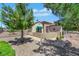 Home featuring desert landscaping, mature trees, and a charming front courtyard at 2166 Alyssa Jade Dr, Henderson, NV 89052