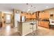 Eat-in kitchen with stainless steel appliances, breakfast bar, pendant lighting and tiled floors at 2166 Alyssa Jade Dr, Henderson, NV 89052