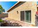 Private backyard area featuring a brick patio with sliding glass door access and a cozy fire pit for outdoor relaxation at 2241 Tall Pine Dr, Las Vegas, NV 89108
