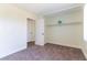 Neutral bedroom features carpet, base trim, and closet with shelving at 2241 Tall Pine Dr, Las Vegas, NV 89108