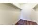 Walk-in closet offers ample storage with carpet floors, white walls, and rod shelves for organized clothing and accessories at 2241 Tall Pine Dr, Las Vegas, NV 89108