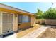 Inviting front entrance with decorative door, stylish exterior lighting, and brick walkway at 2241 Tall Pine Dr, Las Vegas, NV 89108