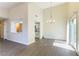 Open-concept living and dining space with view to modern kitchen and bright natural light at 2241 Tall Pine Dr, Las Vegas, NV 89108