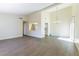 Spacious living area with view of modern kitchen and slider to backyard, perfect for entertaining at 2241 Tall Pine Dr, Las Vegas, NV 89108