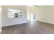 Inviting living room with modern kitchen view, offering an open and airy atmosphere and backyard access at 2241 Tall Pine Dr, Las Vegas, NV 89108