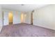 Spacious main bedroom features neutral carpet and access to closet and ensuite at 2241 Tall Pine Dr, Las Vegas, NV 89108