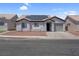 Charming single-story home featuring desert landscaping and solar panels for energy efficiency at 2832 Sing Song Way, Las Vegas, NV 89106