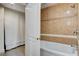 Bathroom features a shower and tub with stylish tile and lighting at 30 Strada Di Villaggio # 227, Henderson, NV 89011
