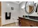 Bathroom boasts a granite vanity and a well-lit shower and mirror at 30 Strada Di Villaggio # 227, Henderson, NV 89011