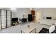 Comfortable studio living area with kitchenette, bed, dining table, and sofa at 30 Strada Di Villaggio # 227, Henderson, NV 89011