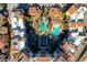 Overhead view of resort-style community pool and spa surrounded by red tile roofs and landscaping at 30 Strada Di Villaggio # 227, Henderson, NV 89011