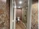 Elegant half bathroom with ornate wallpaper and a vessel sink at 3142 Bel Air Dr, Las Vegas, NV 89109