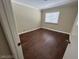 Bedroom featuring hardwood floors, base molding and a window at 3142 Bel Air Dr, Las Vegas, NV 89109