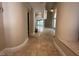 Entryway with beautiful tiled floors and columns leading to a spacious, light-filled living area at 3142 Bel Air Dr, Las Vegas, NV 89109
