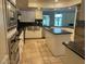 The gourmet kitchen boasts stainless steel appliances and granite countertops at 3142 Bel Air Dr, Las Vegas, NV 89109