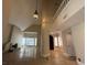 Open concept living room with high ceilings and large windows with a fireplace at 3142 Bel Air Dr, Las Vegas, NV 89109
