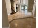 Open-concept living area with tiled floors, steps leading to another level, and access to outdoor views at 3142 Bel Air Dr, Las Vegas, NV 89109