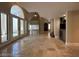 View of a living room with beautiful tile flooring, large windows, and an archway at 3142 Bel Air Dr, Las Vegas, NV 89109