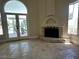 Bright living room with cozy fireplace and expansive views of the outdoors at 3142 Bel Air Dr, Las Vegas, NV 89109