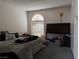 Bedroom with a headboard, many items on the bed, and natural light through the blinds at 3150 Soft Breezes Dr # 1192, Las Vegas, NV 89128