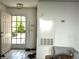 Bright entryway with tiled floor, open door to the outside, and a dog crate at 3150 Soft Breezes Dr # 1192, Las Vegas, NV 89128