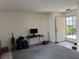 Spacious living room with computer desk, tile entry, and open floor plan at 3150 Soft Breezes Dr # 1192, Las Vegas, NV 89128
