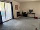 Comfortable living room that leads to the outdoor patio, with gray carpet flooring at 3150 Soft Breezes Dr # 1192, Las Vegas, NV 89128
