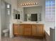 Bathroom with dual sinks, tile floors, and updated fixtures at 338 Brilliant Summit Cir, Henderson, NV 89052