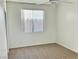 Cozy bedroom with carpet, ceiling fan, and a window to let in natural light at 338 Brilliant Summit Cir, Henderson, NV 89052