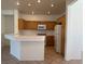 Classic kitchen with wooden cabinets, tiled countertops, and essential appliances at 338 Brilliant Summit Cir, Henderson, NV 89052