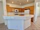 Efficient kitchen with tile countertops, oak cabinets, and white appliances at 338 Brilliant Summit Cir, Henderson, NV 89052