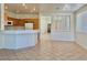 Spacious kitchen with tile floor, wood cabinets and breakfast bar with access to living areas at 338 Brilliant Summit Cir, Henderson, NV 89052