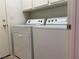 Laundry room featuring a white washer and dryer set, convenient for everyday chores at 338 Brilliant Summit Cir, Henderson, NV 89052