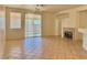 Bright living room featuring tile floors, fireplace, and sliding door access to the outdoor space at 338 Brilliant Summit Cir, Henderson, NV 89052