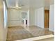 Bright living room with carpet and tile flooring and access to other rooms at 338 Brilliant Summit Cir, Henderson, NV 89052