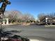 Inviting entrance to Copper Ridge neighborhood with manicured landscaping and street signage at 338 Brilliant Summit Cir, Henderson, NV 89052