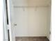 Spacious walk-in closet with shelving and neutral carpeting, ready for organization at 338 Brilliant Summit Cir, Henderson, NV 89052