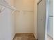 Spacious walk-in closet with wire shelving and carpeted floor offers ample storage at 338 Brilliant Summit Cir, Henderson, NV 89052
