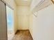 Neutral walk-in closet features carpet, wire shelving and a sliding door at 338 Brilliant Summit Cir, Henderson, NV 89052