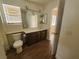 Bathroom with tile flooring, toilet, and vanity featuring a large mirror at 37 Belle Soleil Ave, Las Vegas, NV 89123