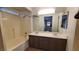 Bathroom featuring a double sink vanity and bathtub with shower at 37 Belle Soleil Ave, Las Vegas, NV 89123