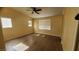 Spacious bedroom with a ceiling fan and natural light from several windows at 37 Belle Soleil Ave, Las Vegas, NV 89123