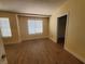 Bedroom with hardwood floors, neutral paint, and plenty of natural light from the window at 37 Belle Soleil Ave, Las Vegas, NV 89123