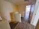 Hallway with wood flooring, leading to a room with natural light at 37 Belle Soleil Ave, Las Vegas, NV 89123