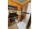 Modern kitchen features stainless steel appliances, including a stove, microwave, and refrigerator at 37 Belle Soleil Ave, Las Vegas, NV 89123